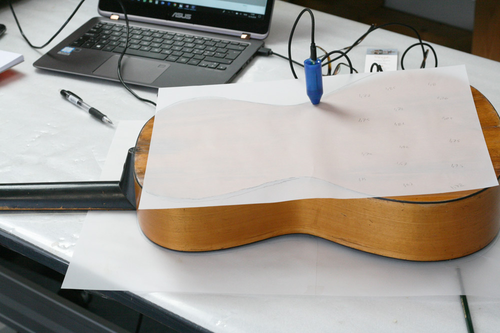 Measuring back thickness of the Schöne #103 guitar.