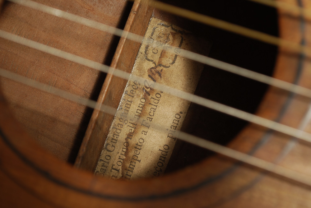 This guitar was built in 1819 and attributed to Carlo Guadagnini (1768–1816). The actual luthier was Carlo’s son, Gaetano II (to distinguish from his uncle, Gaetano I), who continued to use his father’s name and label until he began using his own design in the early 1820s. The unsigned label reads: “Carlo Guadagnini fece in Torino nell’anno 1819.” Maccari Pugliese collection. (Photo 2 of 3)