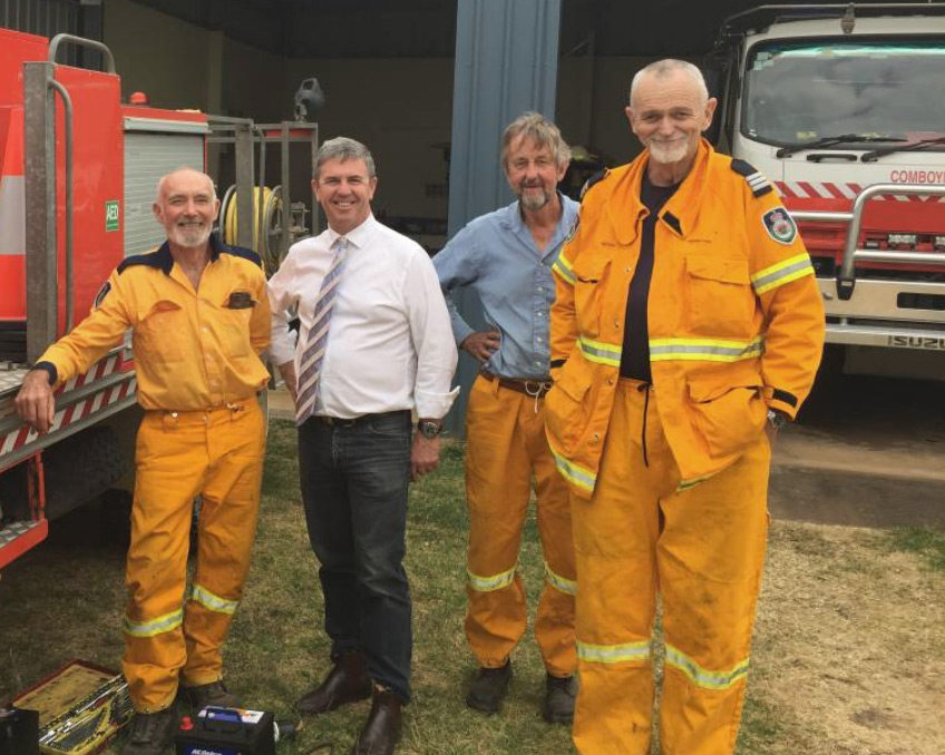 Graham (third from left) with members of the Comboyne Fire Brigade and parliament member, David Gillespie.