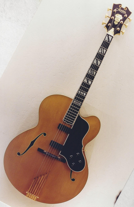Just a pretty composite archtop. It’s an L-5 body outline with Super 400 F-holes and a D’Angelico headstock with a Johnny Smith Double pickguard – the best of several guitars assembld together. Photo 2 of 2.