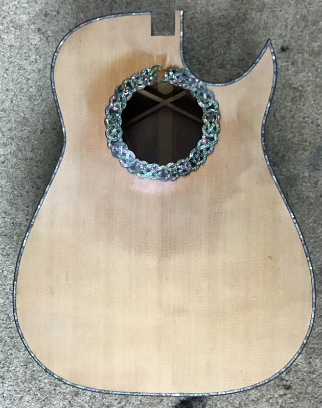 Here’s an abalone bordered and rosette guitar I’m getting ready to fit the neck on.