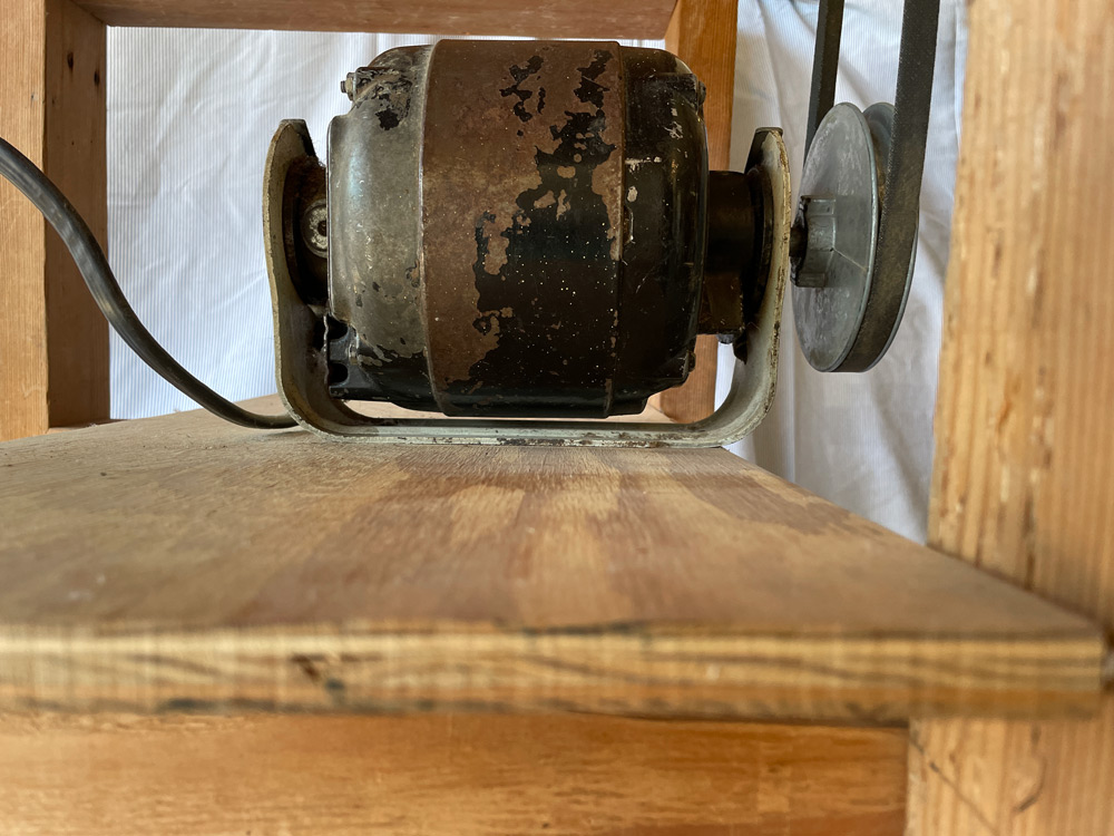 A used washing machine motor was used to drive the sanding drum. Notice in the side view that the pulleys have a one-to-one ratio.
