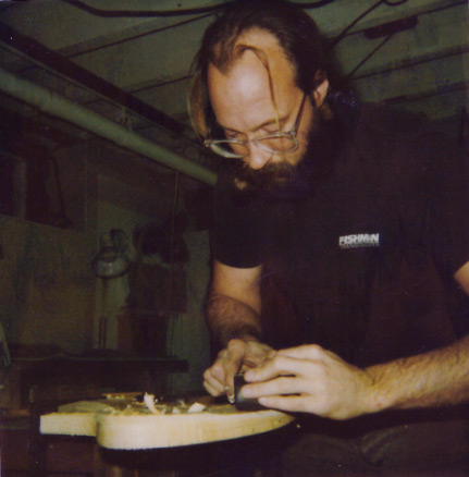 Ken uses a shop-built lignum vitae plane with Japanese wedged iron to sculpt a Fly prototype. 1989, Seymour CT shop.