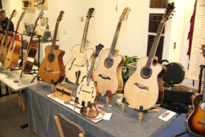 Display of instruments by John Carrigan of Curly Creek Guitars. (Korsmo)