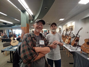 Hangin' out at the exhibition: John Carrigan (r) of Curly Creek Guitars and Mark Rossier. (D. Olsen)