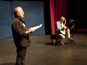 Jeffrey Elliott moderates the classical guitar listening with Michael Partington performing. (McElrath)
