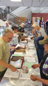 GAL Board member Bob Petrulis works the other end of the registration table. (T. Olsen)