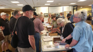 Members at registration check in with Bon Henderson and Susan Grider Williams. (T. Olsen)