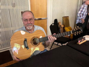 Brent McElroy (of LaConner Guitar Show fame) with one of his creations. (Woo)