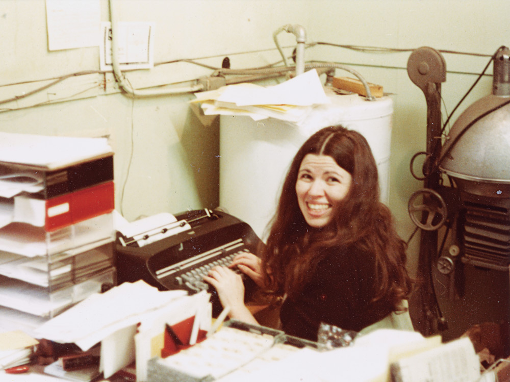 Bon grins as she operates the Guild’s first major equipment acquisition, a used IBM typewriter.