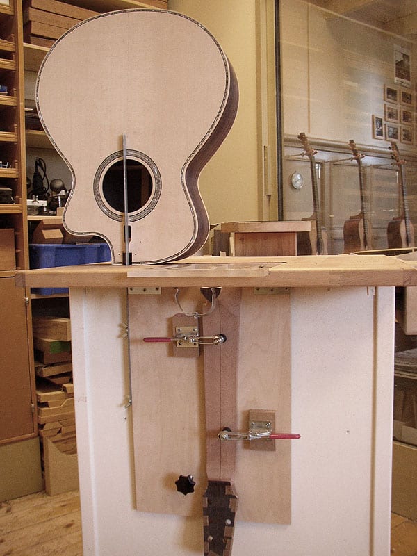 This one was not in the magazine. It shows a different view of the pipe clamp vise and the neck dovtailing jig.