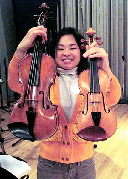 Violinist Chien Tan compares a treble violin (right) with a standard violin.