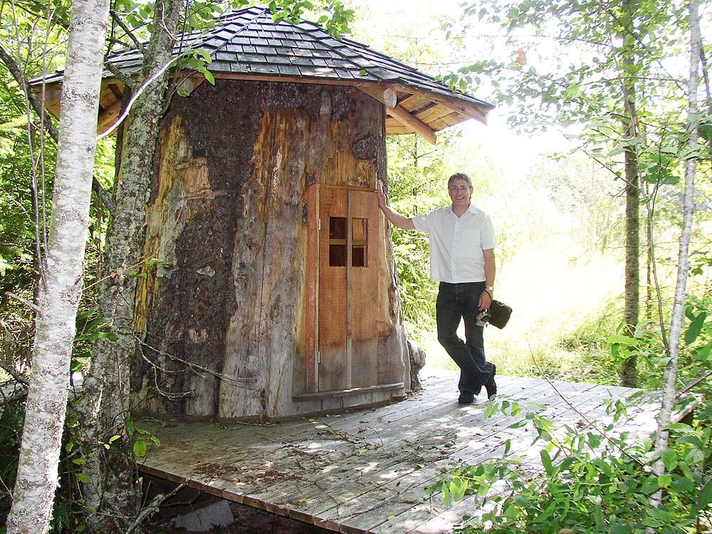 Here's one that did not appear in the magazine. Michael visits a real "log house," that is, a house made of a single hollow log.