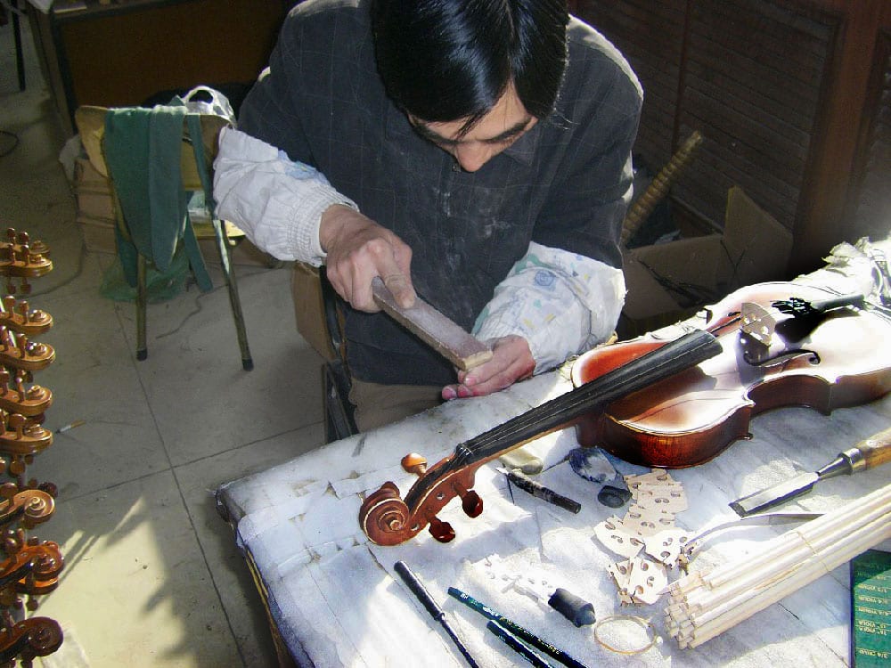 Bill Garafalo visits a violin factory in China. (image 3 of 8)