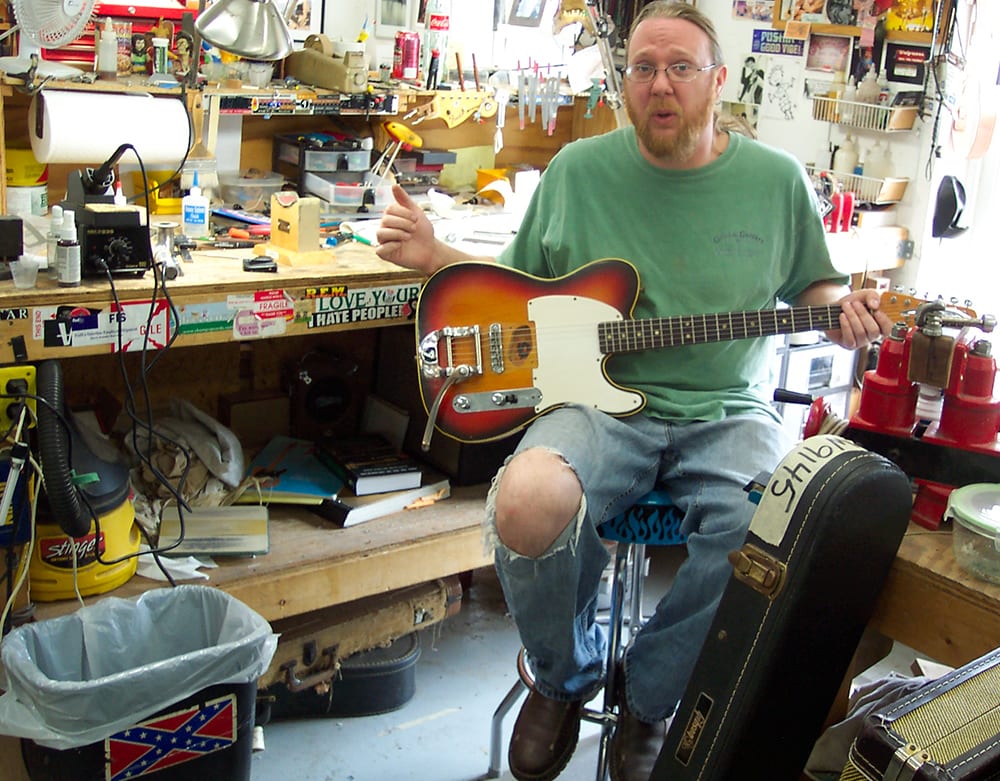 Lin Crowson shows “one of ours” – a guitar that he is considering buying for his own.