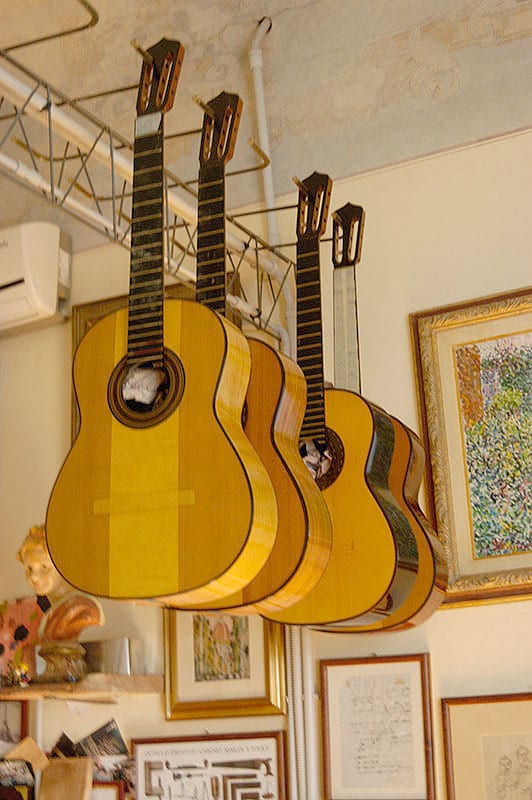 Recent guitars hanging in Andrea Tacchi’s shop.