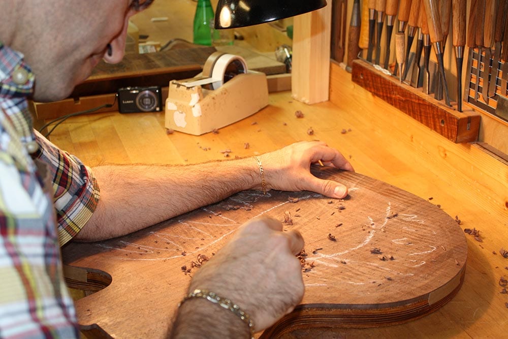 Carving a walnut archtop back.