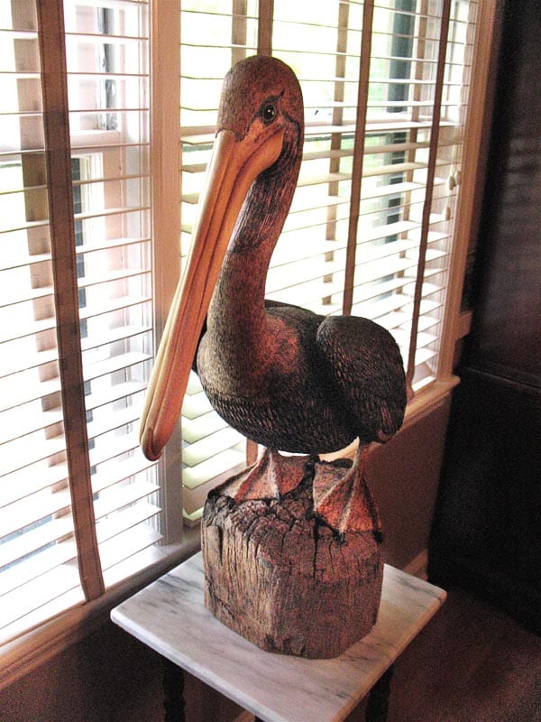 After closing the guitar shop, Wade did custom carving at a flea market but quickly realized it was not going to work as a business. This pelican stands on a Brazilian rosewood stump (Image 1 of 2)