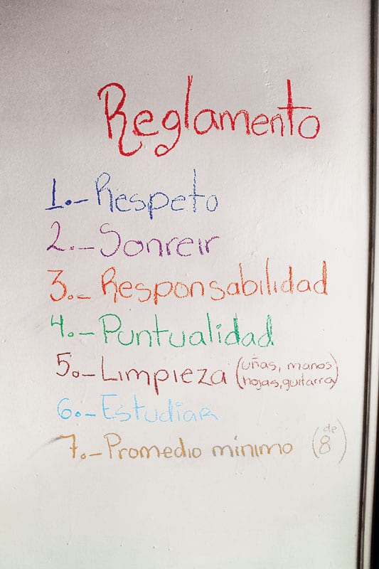 Rules of daughter Veronica’s guitar school for children:  If you are late, 15 peso fine.  If you forget your music, 10 pesos.  If your nails are not clean, you will clean them on your clothes.  If you fail to respect the teacher, the students or the furnishings, expulsion!  If you don’t put your seat back, you will put all the seats back for the entire class. (image 1 of 2)