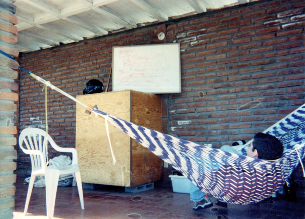 Mexico, 2000. Toms puts in some quality hammock time, absorbing the diagrams drawn on the whiteboard by Boaz.