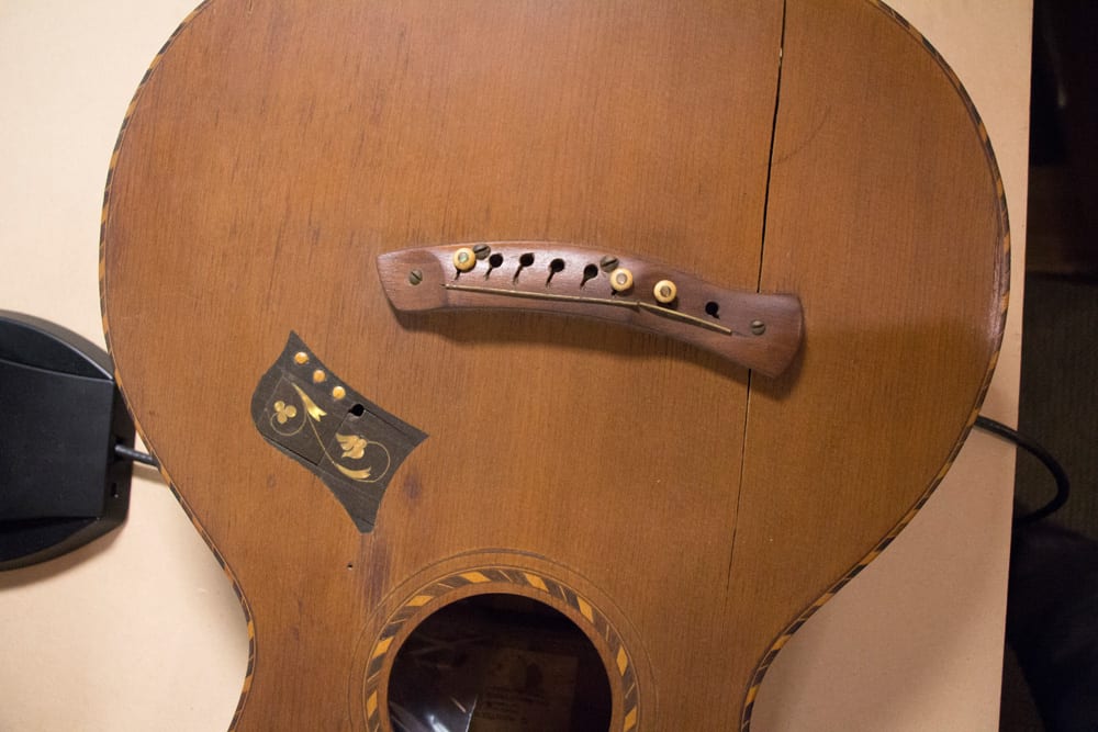 Here’s a cool old Hawaiian guitar which was also on the table (Image 2 of 6). 