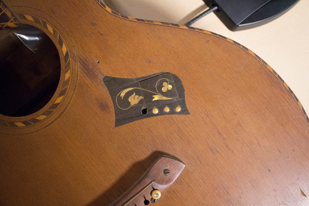 Here’s a cool old Hawaiian guitar which was also on the table (Image 3 of 6).