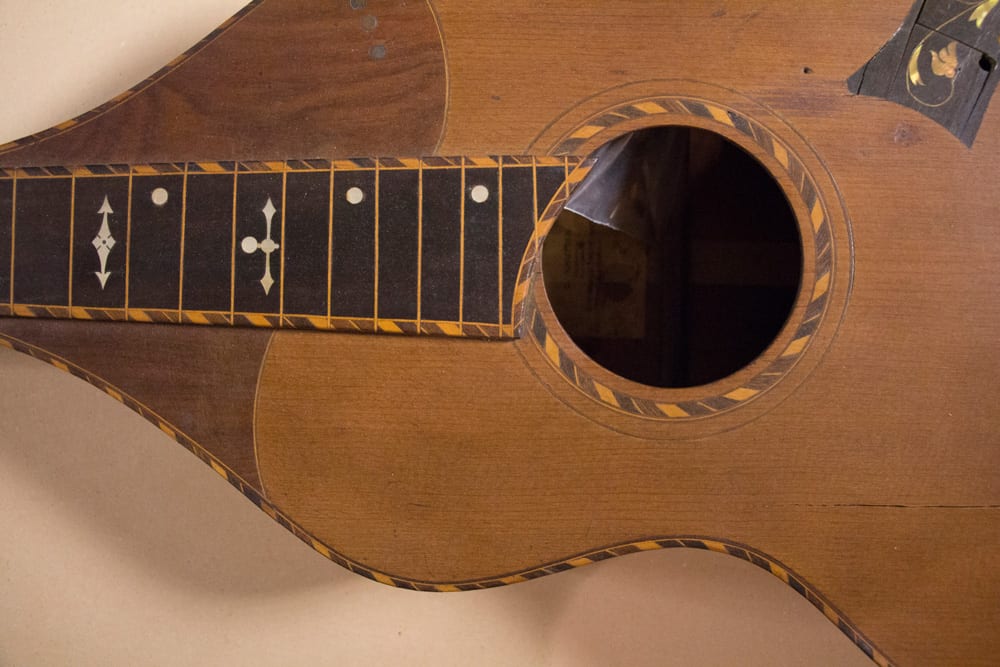 Here’s a cool old Hawaiian guitar which was also on the table (Image 4 of 6).