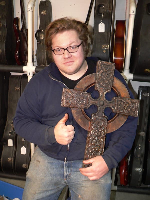 Elliot with some of his metal art.