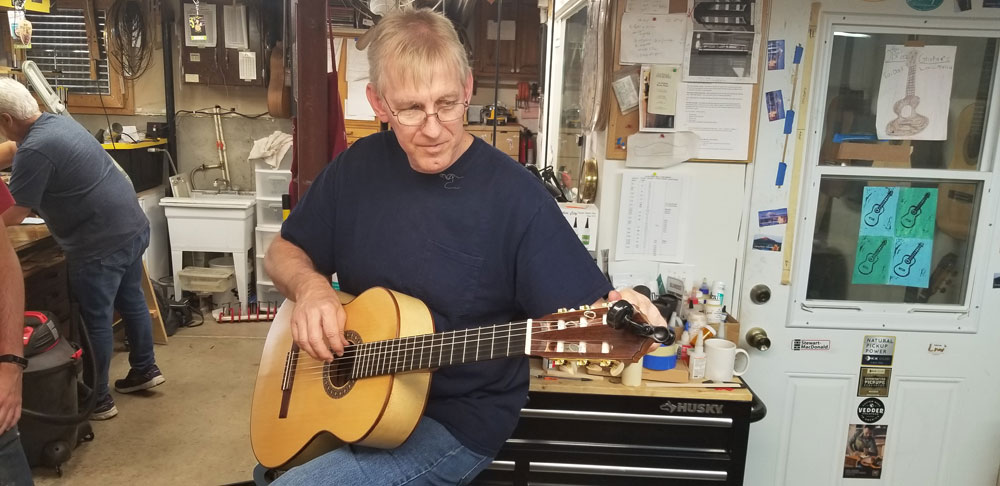 Here’s Robbie playing a classical guitar he made using cardboard for the back and sides – along the lines of the famous one done by Torres.  It sounded just fine.