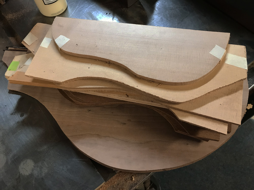 Spruce and mahogany ukulele tops and backs. Mahogany for uke sides comes from the neck stock.