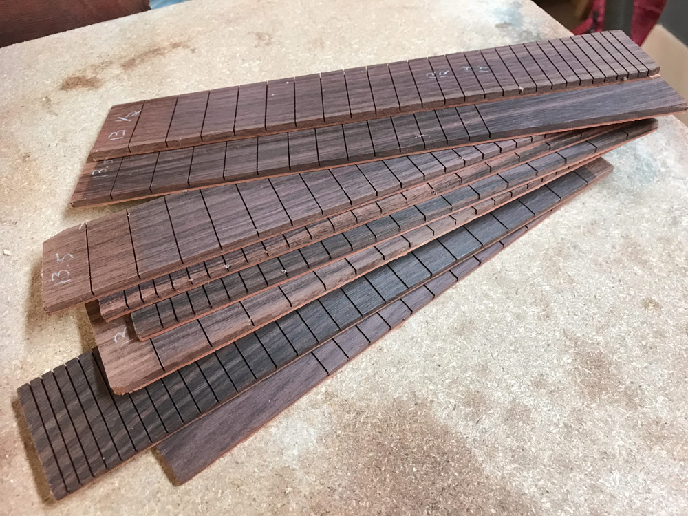 Just to present ideas, these ukulele or mandolin fretboards were laminated from mahogany and rosewood.